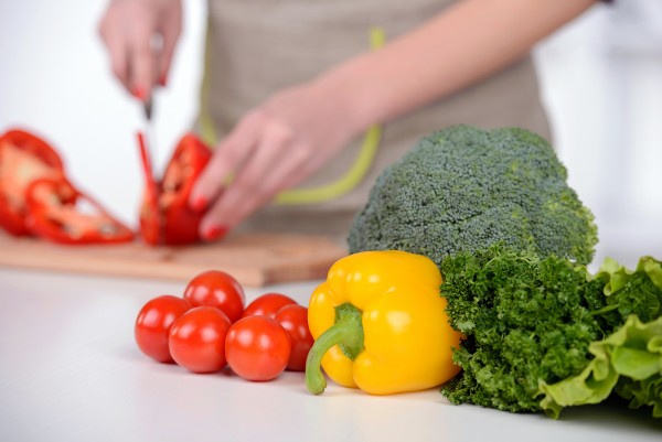 Young Woman Cooking. Healthy Food - Vegetable Salad. Diet. Dieting Concept. Healthy Lifestyle. Cooking At Home. Prepare Food